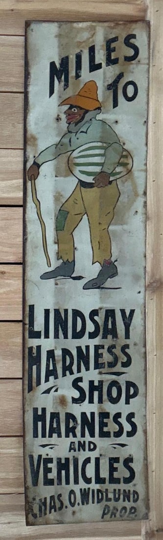 Lindsay Harness Shop & Vehicles w/Image Ithaca Metal Sign: rated 7, 48.5"x12". This SST vertical sign shows wear, rust and extra nail holes in the field. 
