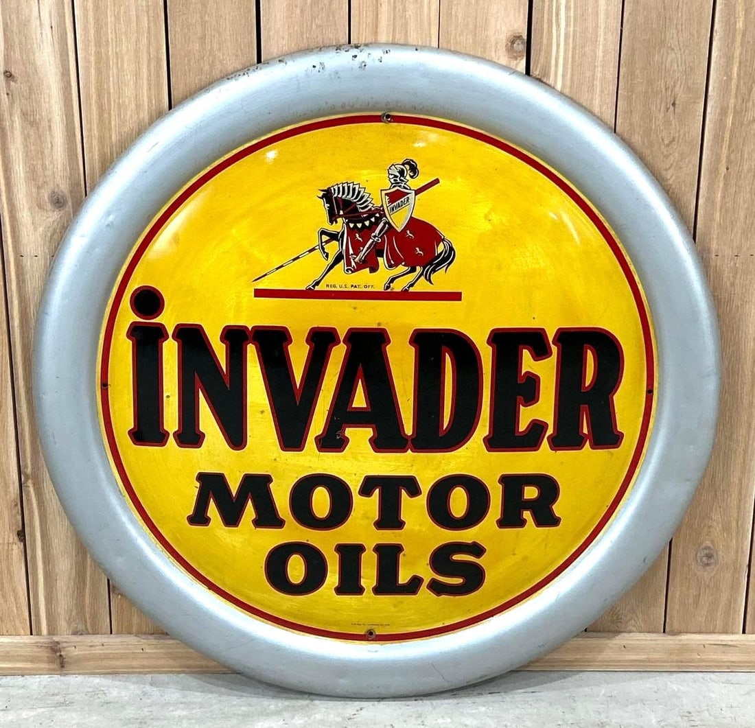 Invader Motor Oils Self-Framed Convex Sign W/ War Horse Graphic: Rated 8.5, 45" Dia. This SST sign has good color and shine throughout with very minor discolorization in the field. Sign shows light paint loss and scratching at the hanging holes, as well as,