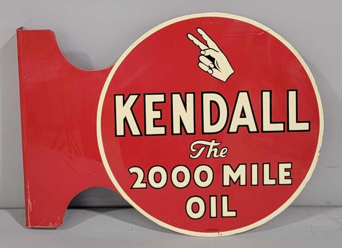 Kendall "The 2000 Mile Oil" Metal Flange Sign (TAC): rated 9.25 & 9, 12"x18". This die-cut metal flange sign has very good color and shine. Display is nice, reverse has some light wear. Marked "A-M." dated 1950. Rarity 4. TAC #061647