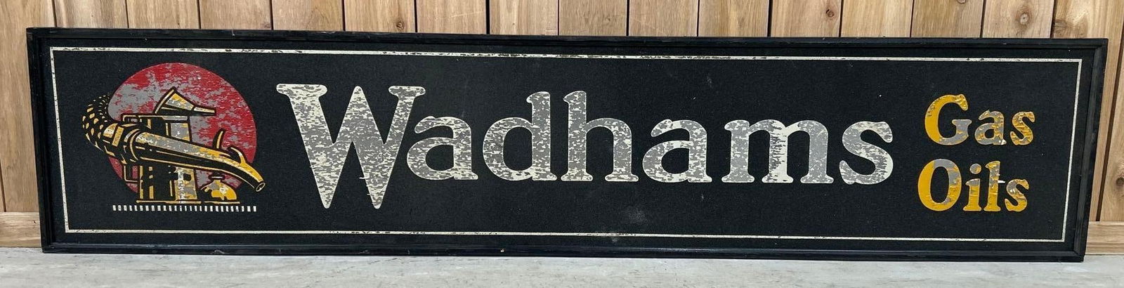 Wadhams Gas Oil w/Logo Smaltz Painted Metal Sign (TAC): rated 8, 18"x84". This single-sided Smaltz painted metal wood framed sign has good color. Smaltz paint is in excellent condition, while the other painted areas are peeling.Rarity 8. TAC #044540
