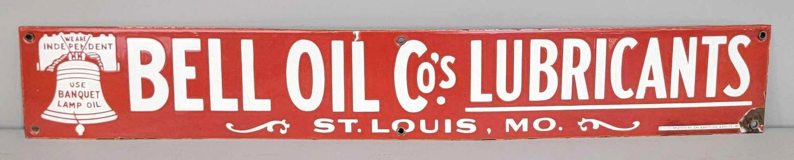 Bell Oil-Gas Co. w/Logo Porcelain Sign (TAC): rated 9, 4"x26.5". This SSP sign has very excellent color and gloss, field is clean. Sign has chip at lower right-hand mounting hole. Marked Burdick. Rarity 8. TAC #032338