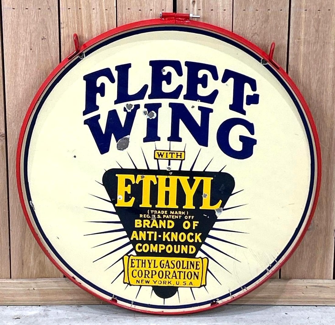 Fleet-Wing w/Ethyl Logo Porcelain Sign (TAC): rated 8.25, 30"D., the DSP sign has good color and gloss, has chips and wear in the field.Rarity 5. TAC #062967