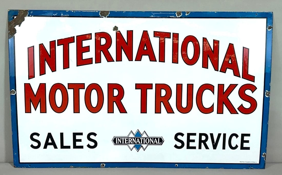 International Motor Trucks Sales & Service w/Logo Porcelain Sign (large)(TAC): rated 9, 30"x48". This SSP sign has excellent color and gloss, field is clean. Sign has small chip in the upper field, as well as a large chip and crease at the upper left-hand corner. Marked. Rarity