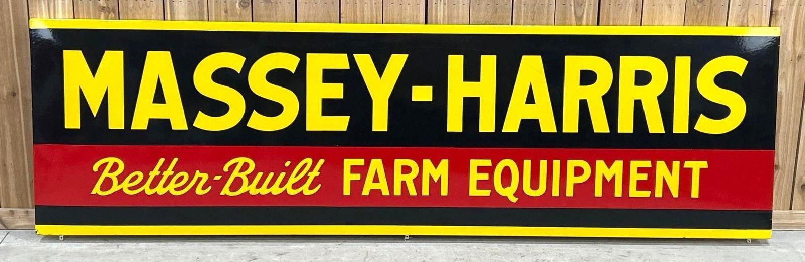 Massey-Harris Better Built Farm Equipment Porcelain Sign: Rated 9.5. 28" x 96". This stunning SSP cookie cutter styled sign has brilliant color and gloss throughout. Sign has one minor stain on the "A" in Harris, as well as, minor porcelain loss mostly on