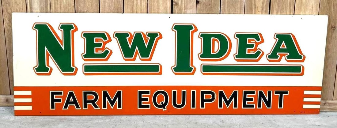 New Idea Farm Equipment Painted Metal Sign (BLACK LETTERS): (Rated 8.9) 24" x 72". This SST sign has good color and shine throughout. Sign shows scratches with paint loss, as well as surface staining and paint loss on the edge. Marked A-M sign Co. Rarity 3.