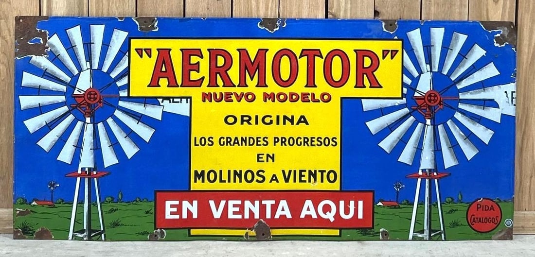 Aermotor En Venta Aqui w/Great Graphics Porcelain Sign (TAC): rated 9, 26"x59", the SSP sign has very good color and gloss, has light wear in the field, has large chips at the mounting holes. Rarity 5. TAC #062995