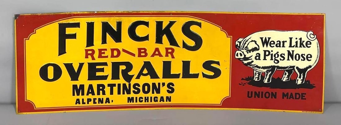 Fincks Red Bar Overalls "Wear Like a Pigs Nose" Metal Sign (TAC): rated 8.75, 11.5"x35.5", the SST embossed sign has good color and shine with a couple fine scratches. Sign has paper marks at the upper left-hand corner. Marked Donaldson. Rarity 7. TAC #061465
