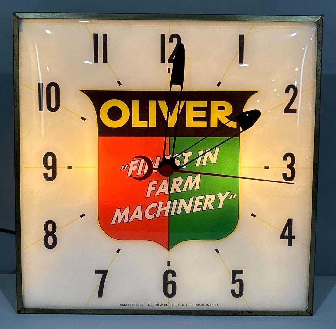 Oliver "Finest in Farm Machinery" in Shield Logo Square Pam Clock: rated 9+, 15"x15", the clock is in very good condition, lights up and works.