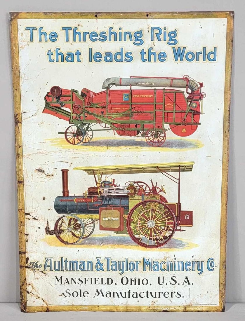The Aultman & Taylor Machinery Co. "The Threshing Rig That Leads the World" Metal Sign (TAC): rated 7.5, 19.5"x13.5", the SST embossed sign has good color, no shine, has wear, light soiling and minor ceases in the field, has wear around the perimeter, marked The Meek Co.. Rarity 8. TAC #062498