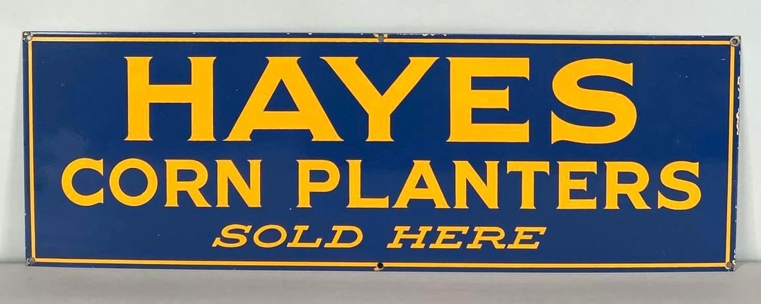 Hayes Corn Planters Porcelain Sign: Rated 9.0. 10" x 30". This SSP has strong color and gloss with very minor surface scratches in the field. The outer edges and hanging holes show minor porcelain loss. Rarity 8. TAC #061864