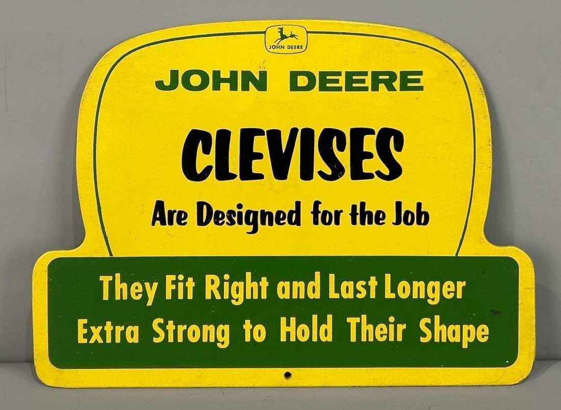 John Deere Clevises Masonite Sign (TAC): rated 8.9, 11"x15", the die-cut Masonite sign has very good color and shine, has light wear. TAC #032382