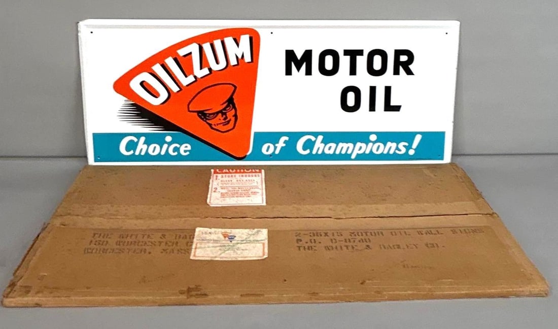 NOS Oilzum Motor Oil Self-Framed Tin Sign W/ original Shipping Box: (Rated 9.75) 15.5" x 36". This SST sign features perfect color and gloss throughout. Sign only shows light storage wear on the outer edges. Original Box included. Marked, "AM 10-84". Rarity 2. T