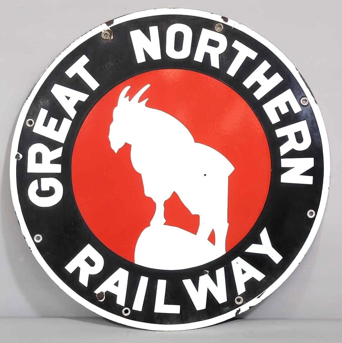 Great Northern Railway w/Logo Porcelain Sign (TAC): rated 8, 24"D. This SSP sign red has good gloss and color. Black is dull and no gloss. Sign has a few small chips. Rarity 6. TAC #061636