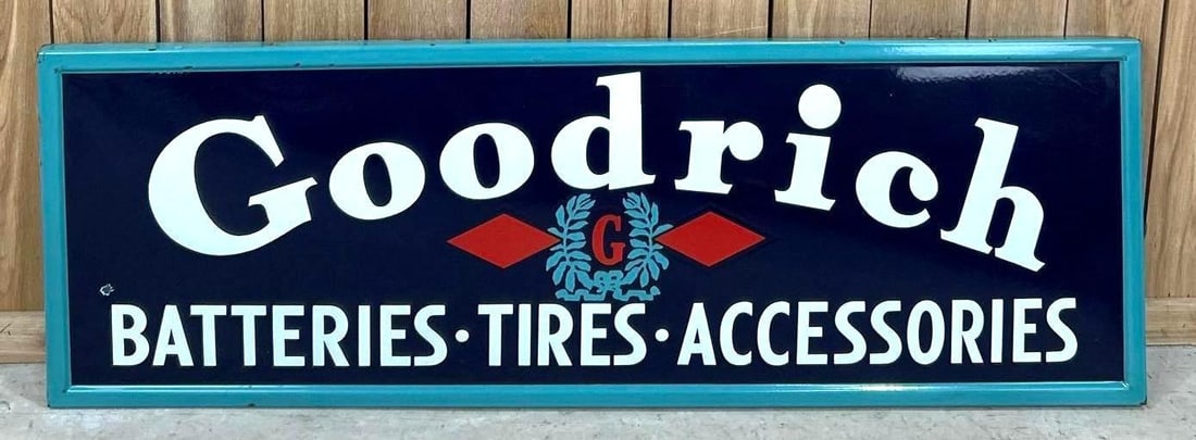 Goodrich Tires Self-Framed Porcelain Sign: (Rated 8.9). 20" x 60". This SSP sign features strong color and gloss throughout. Sign shows surface scratches in both fields as well as a non distracting porcelain chip on the outer field.