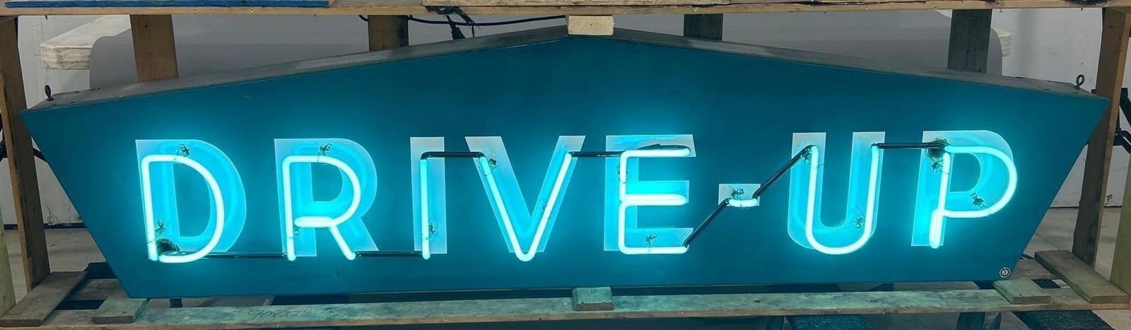 Drive-Up Porcelain Neon Sign (TAC): rated 9, 22.5"x90". This SSP rolled edge neon sign has good color and gloss, field is clean. Sign has small chips around the perimeter. TAC #061720