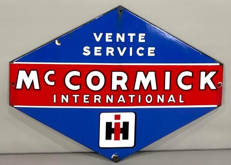 McCormick International Vente Service Die-Cut Porcelain SIgn: (Rated 8.9). 23.5" x 31.5". This SSP sign has strong color and gloss throughout the field. Sign has notable vertical oxidation line across the center of the piece. Sign shows porcelain loss on the per