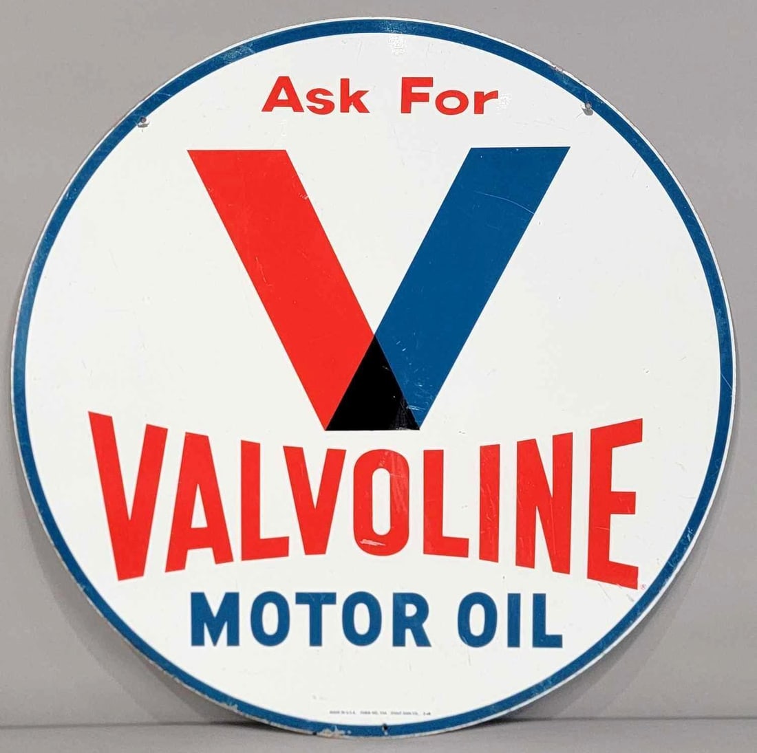 Ask for Valvoline Motor Oil Metal Sign (TAC): rated 8.25, 29.75"D., the DST sign has good color and shine, has wear and a few fine scratches, marked Stout, dated 1968. Rarity 3. TAC #62640