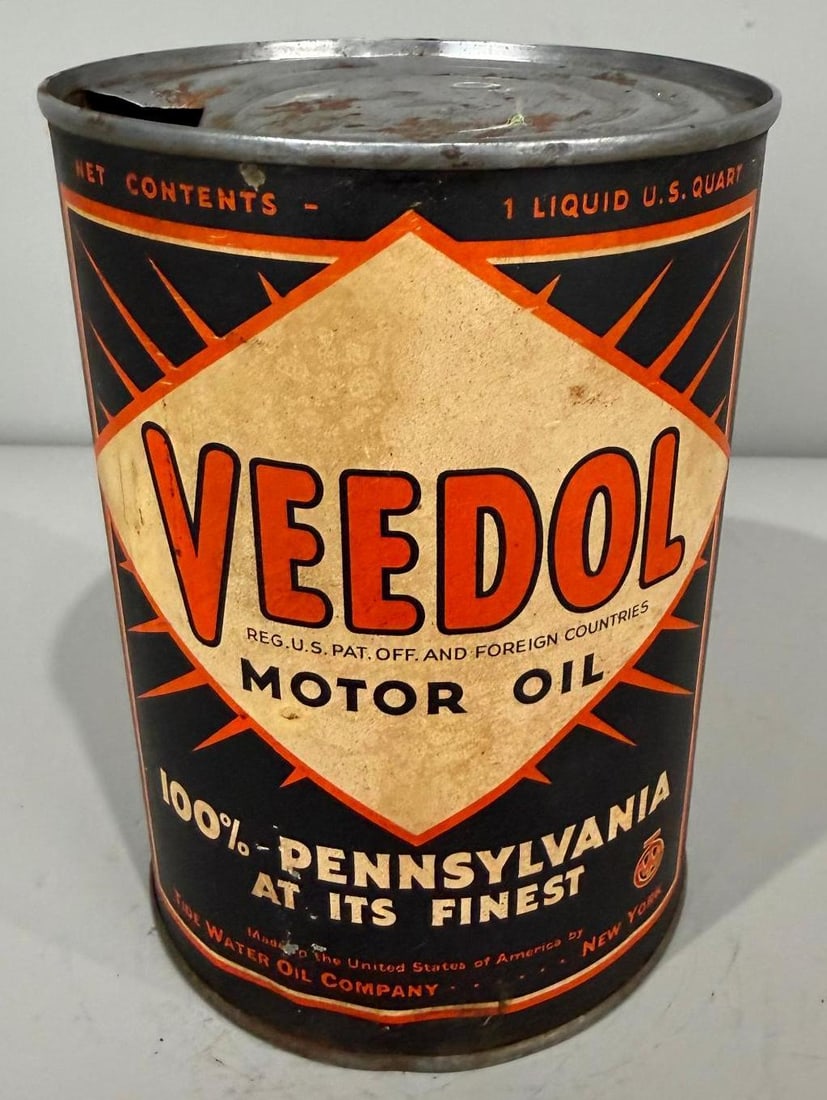 Veedol Motor Oil w/ Starburst Logo Metal Quart Can: rate 7, the metal quart can shows wear and age, is empty
