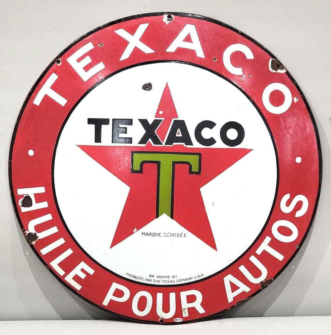 Texaco (black-T) Huile Pour Autos Porcelain Sign (TAC): rated 7.5, 25.5"D., the SSP pillow sign, has good color and some gloss, has chips in the field and around the perimeter. TAC #032422