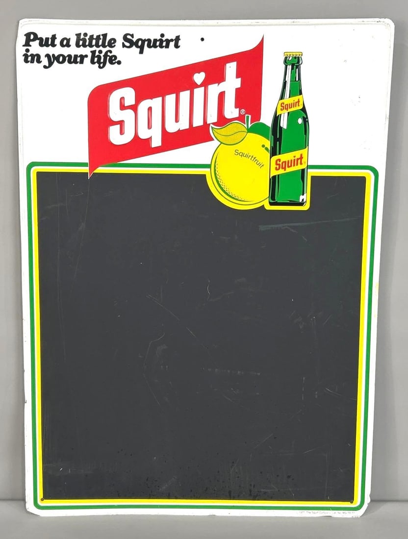 NOS Squirt Menu Board W/ Bottle Graphic: (Rated 8.9). 20" x 28". This SST sign has good color and shine with surface staining and scratching throughout the entire piece. Marked, "Stout Sign Co." Rarity 2. TAC # 062340