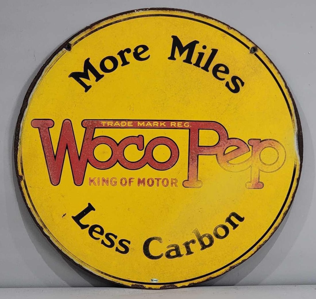 Woco Pep More Miles Less Carbon Porcelain Sign (TAC): rated 5.5, 25.5"D., the DSP sign has heavy wear and chips around the perimeter. Rarity 6. TAC #036625