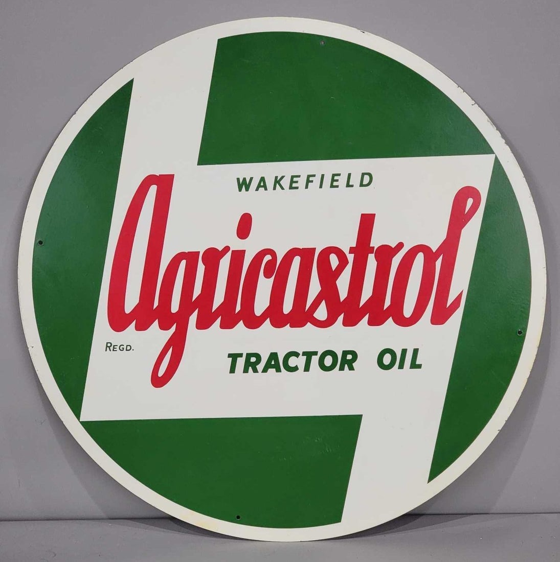 Wakefield Agricastrol Tractor Oil Metal Sign (TAC): rated 9, 23.75"D., the SST sign has very good color and shine, light wear, marked A Cowling Sign. TAC #063263