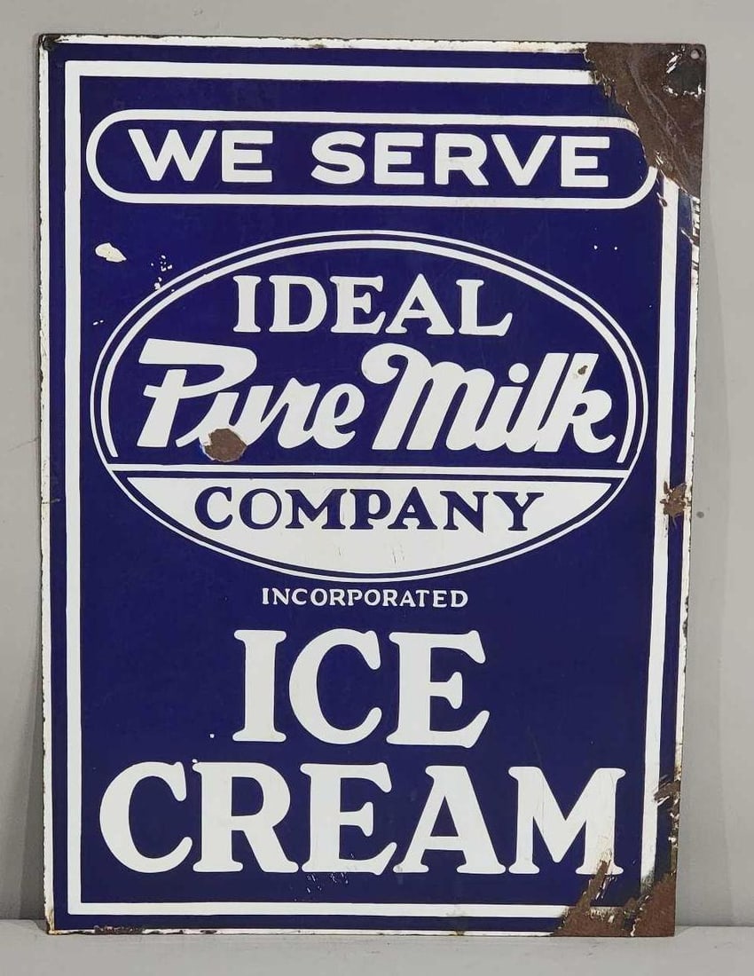 We Serve Ideal Pure Milk Ice Cream Porcelain Sign (TAC): rated 7.5, 28"x20", the DSP sign has good color and some gloss, has wear and small chips in the fields, larger chips around the perimeter. TAC #032451