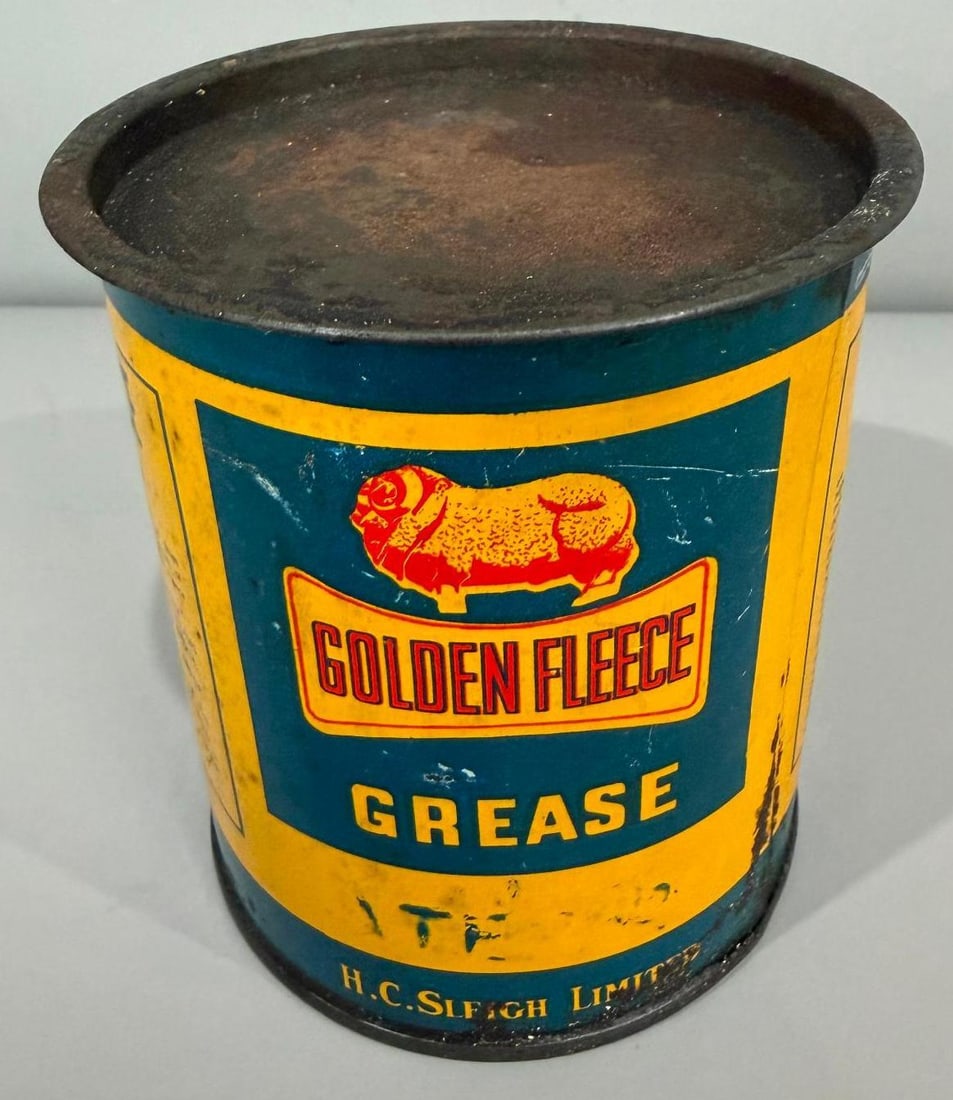 Golden Fleece Grease Metal Can: rate 8, the one pound metal grease can has good color and shine, shows some general age wear, mostly on the reverse, is empty