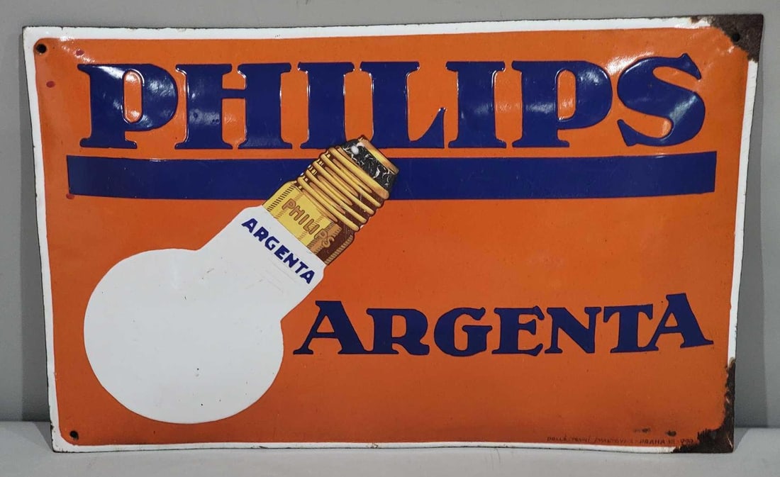 Phillips Argenta w/Image Porcelain Sign (TAC): rated 9, 11.25"x17.5", the SSP domed sign has good color and gloss, has light wear in the field, chips at the right-hand corner, is marked. TAC #063207
