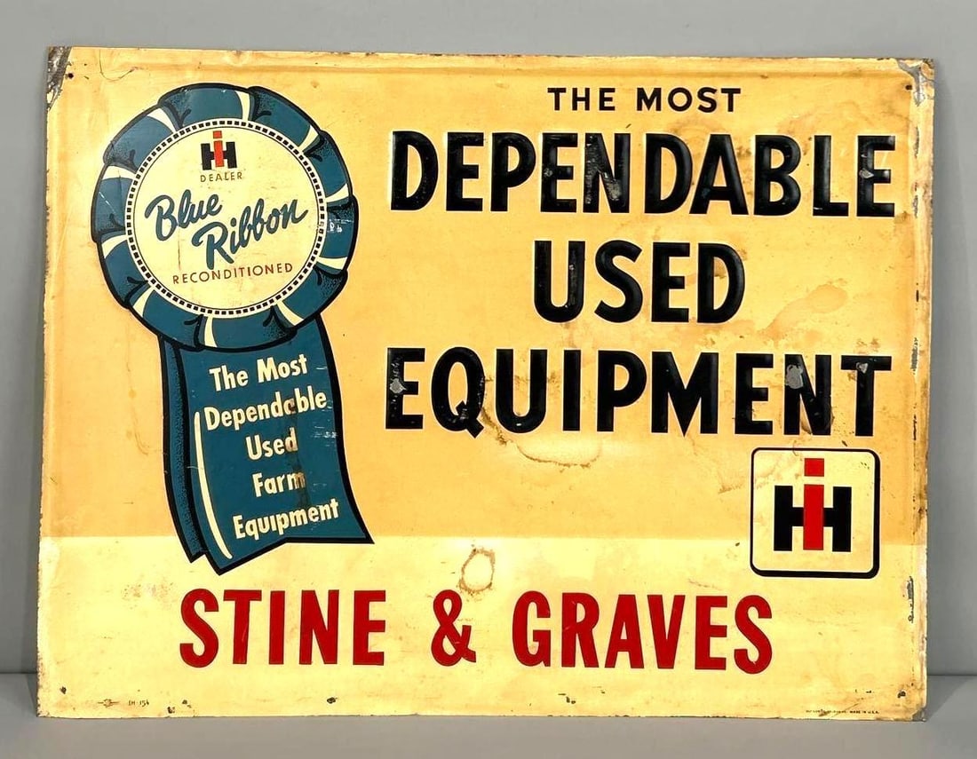 IH Blue Ribbon "The Most Dependable Used Equipment" Metal Sign (TAC): rated 7, 18"x24", the SST sign has wear and staining, marked Stout. Rarity 5. TAC #062810