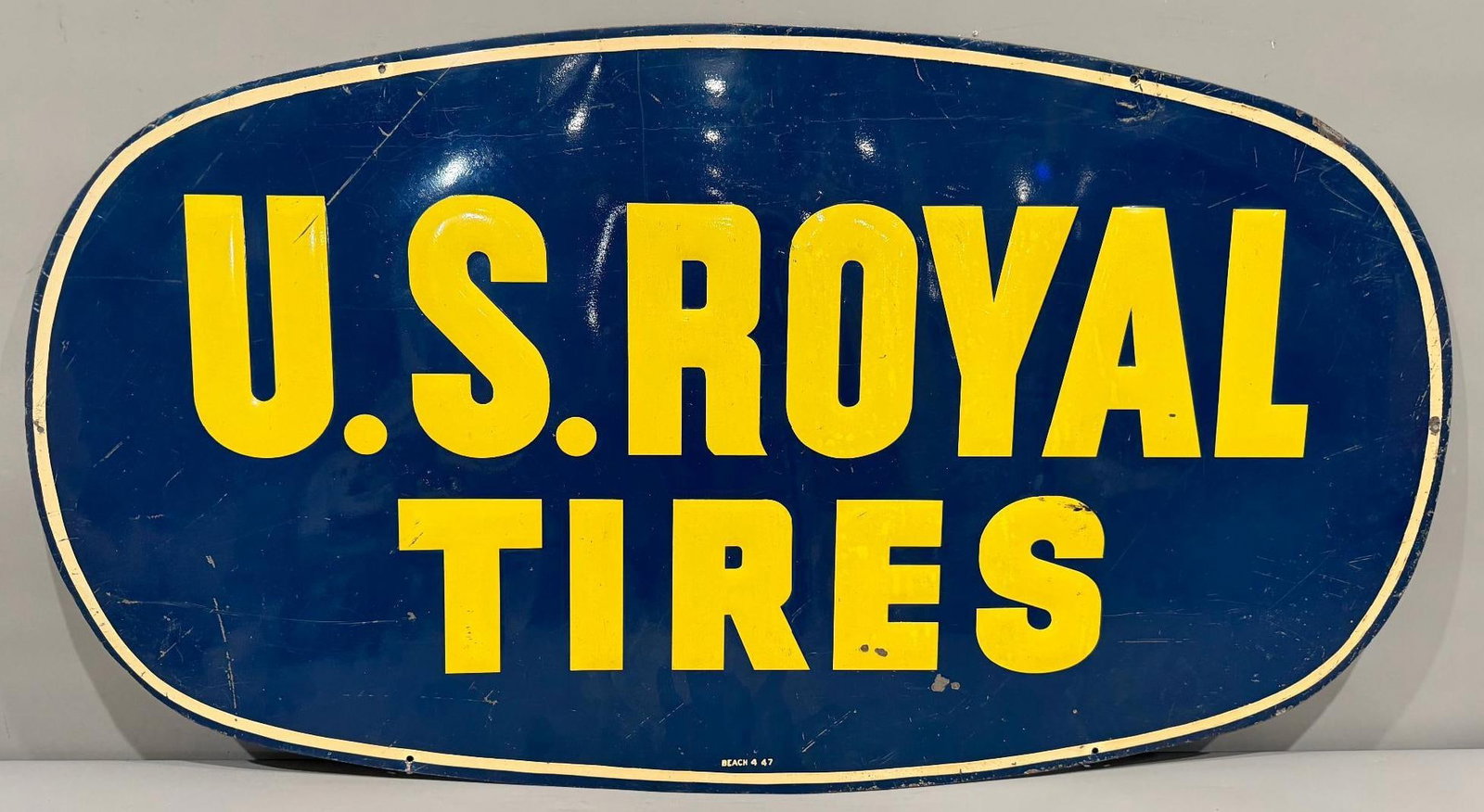 US Royal Tires Metal Sign: rate 7, 22" x 40", the single sided metal sign has good color shine, shows wear throughout