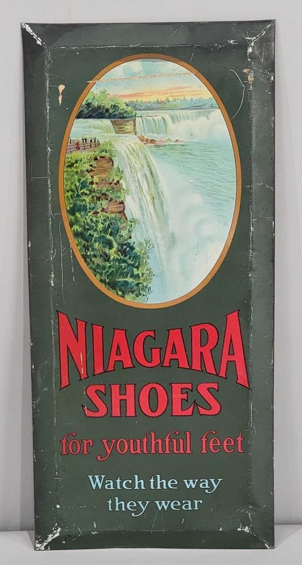 Niagara Shoes "for youthful feet" Metal Sign (TAC): rated 7.25, 19"x8.75', the SST cardboard backed sign has good color, has wear and scratches, marked American Art Works on back. TAC #063279