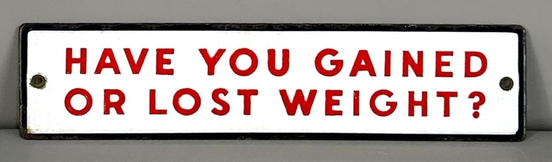 Coin Operated Scale Porcelain Attachment Sign: Rated 9.0. 2.75" x 11.25". This SSP sign has excellent color and gloss with notable edge wear and staining on all four sides. Rarity 2. TAC #062042