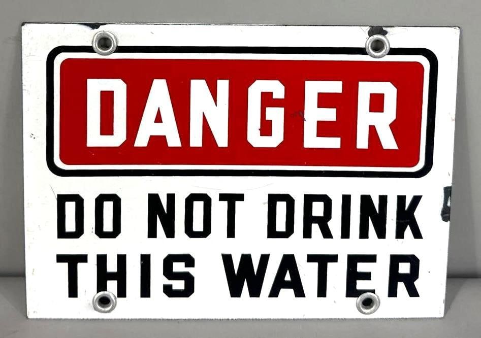 Danger "Do Not Drink This Water" Single-Sided Porcelain Sign: (Rated 9.0). 5.5" x 7". This SSP sign has good color and gloss with minor surface staining and porcelain loss on the outer edge. Rarity 2. TAC # 062194.