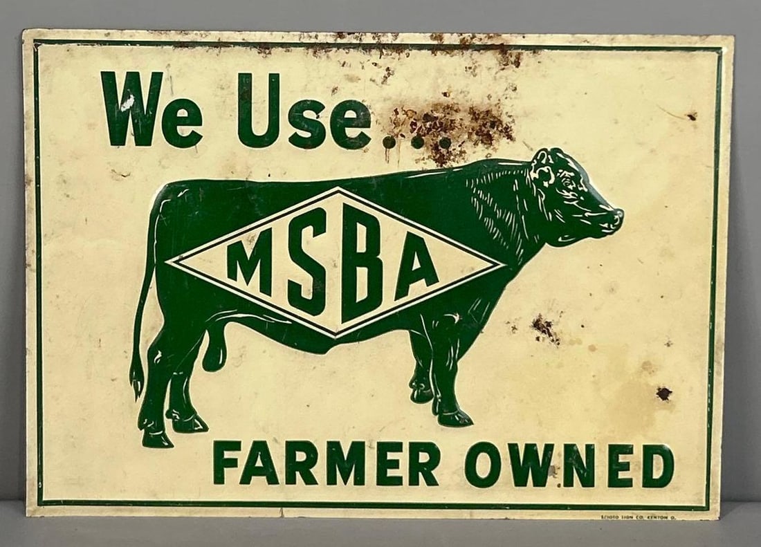 We Use MSBA Farmer Owned Embossed Tin Sign W/ Cattle Graphic: (Rated 7.25). 10" x 14". This SST sign shows paint loss and surface staining throughout both fields. Graphic still presents well. Marked, "Scioto". Rarity 2. TAC # 062330