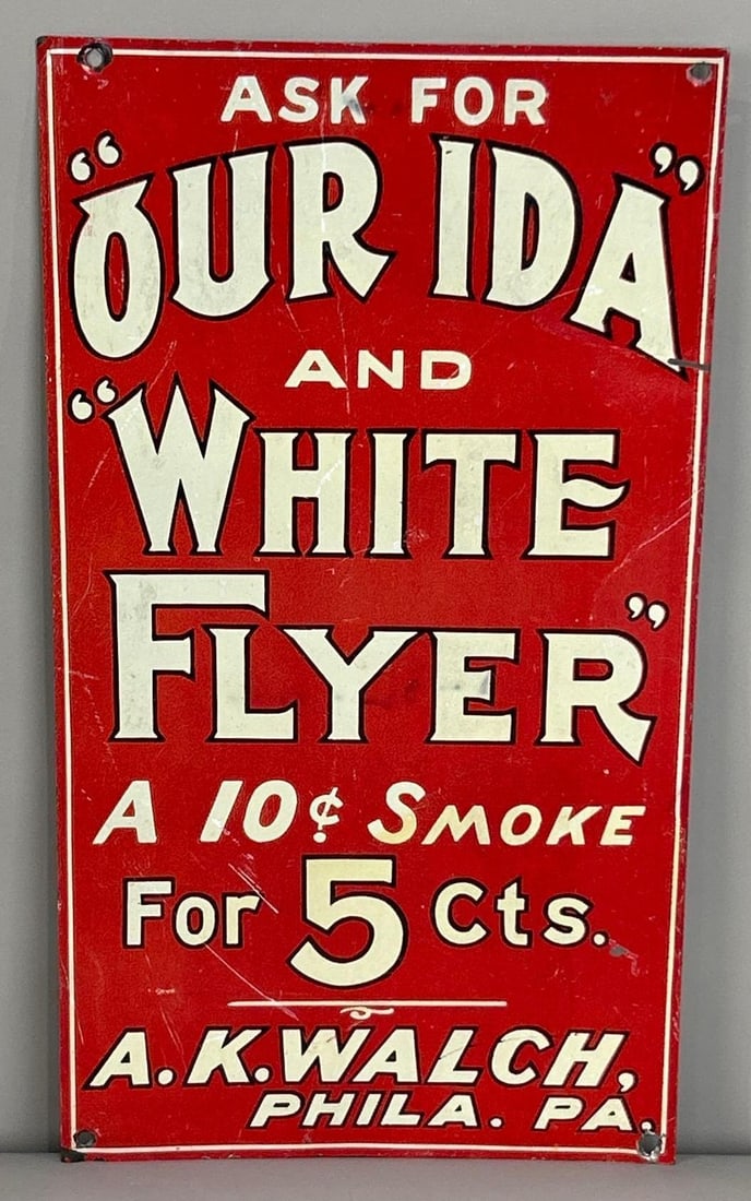Our Ida And White Flyer 5¢ Cigars Sign: (Rated 7.5). 7.5" x 13.5". This SST sign has fair color throughout with notable scratches and staining in the field. Outer edge has added holes and other wear. Rarity 2. TAC # 06246.