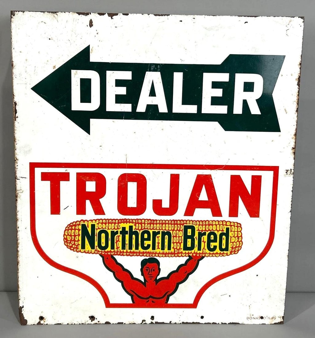 Trojan Dealer Painted Metal Flange Sign W/ Arrow Graphic: (Rated 7.25, 7.25). 17.5" x 20". This DST sign has notable staining and deep scratches throughout both sides. Outer edge shows paint loss. Marked, "Donasco". Rarity 2. TAC # 033988