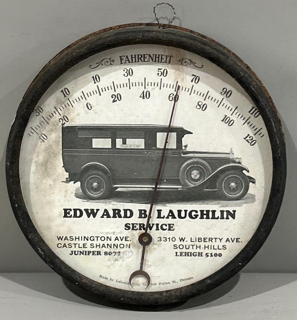 Edward Laughin Service w/Limo Round Metal Thermometer: rated 6.9, 7"D., the round metal thermometer has soiing to the face. 