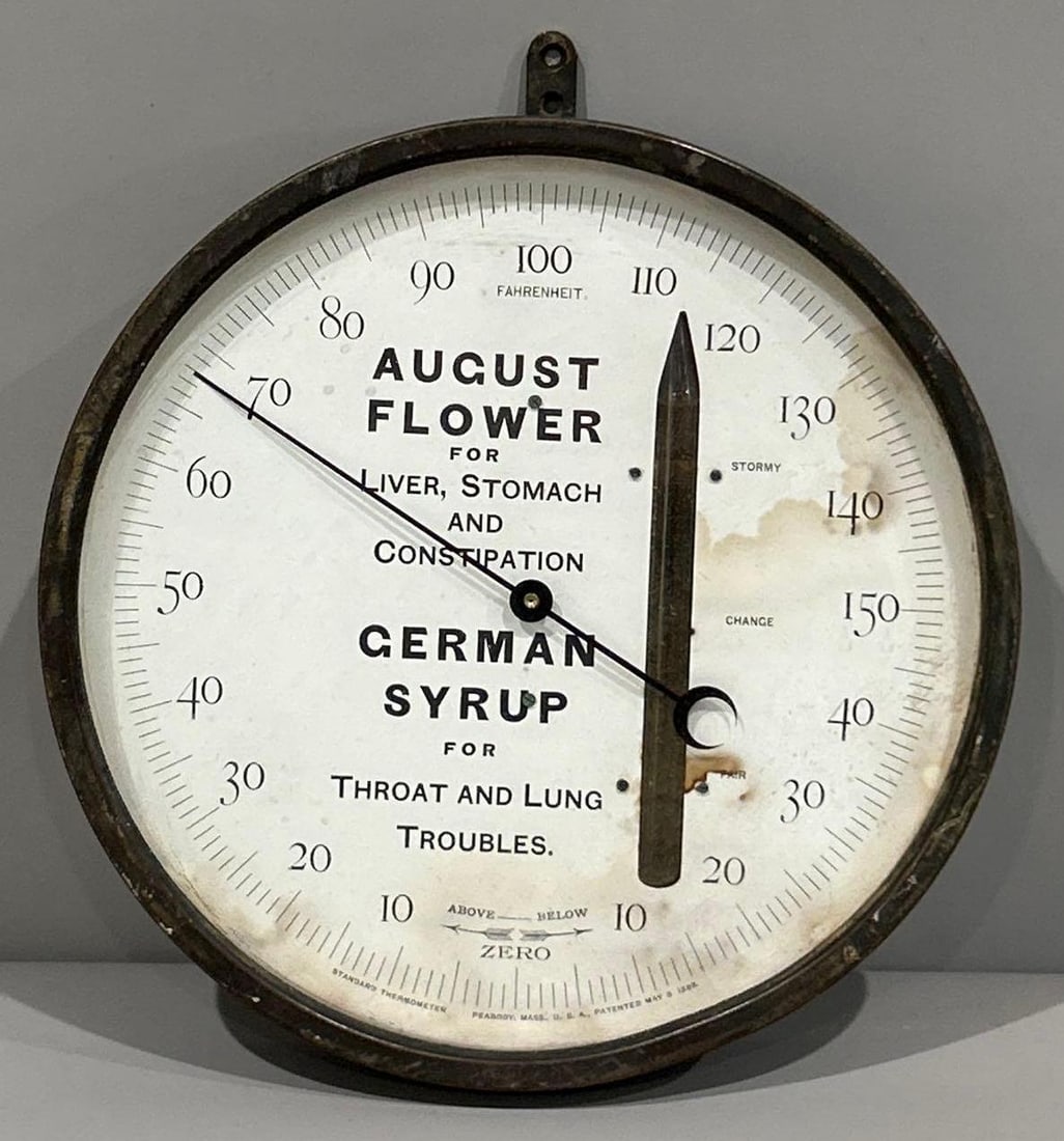 German Syrup/August Flower Round Metal Thermometer: rated 7, 9"D., the face is water stained.