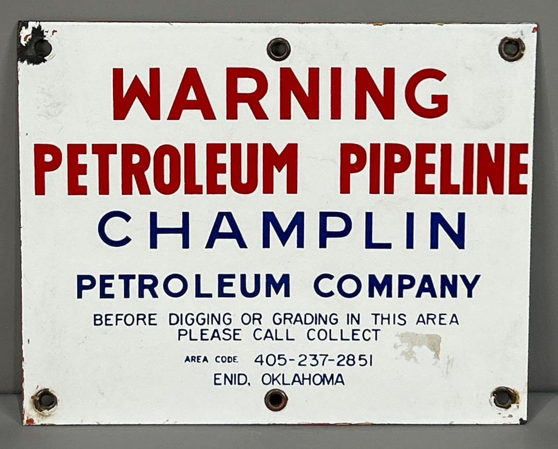 Champlin Pipeline Indicator Porcelain Sign: Rated 8.9. 8" x 10". This SSP has good color and gloss with paint residue along the outer edge, as well as, porcelain loss on the top left hand corner. Rarity 2. 