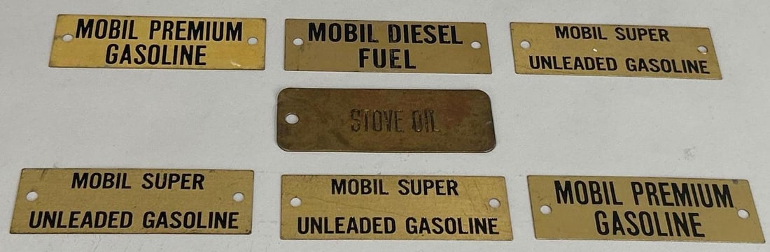 7 Brass Mobil Gas Identification Tags: Rated 9(all). 1.5" x 4". The tags all have minor tarnish. One says "Stove Oil", the rest are Mobil related. Rarity 1.