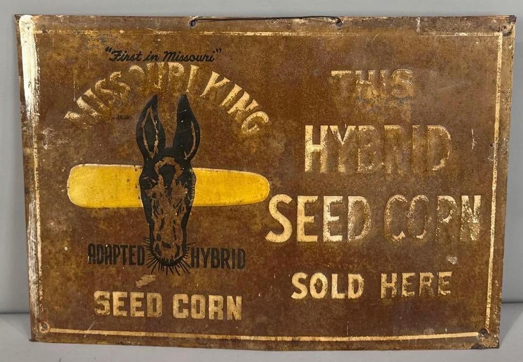 Missouri King Seed Corn Embossed Tin Sign W/ Mule Graphic: (Rated 6). 9.5" x 13.5". This SST sign has significant rust staining and paint loss throughout. Rarity 3. TAC #062183