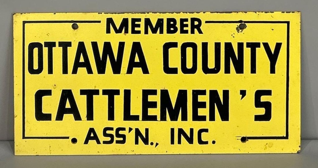 Ottawa Country Cattleman's Association Metal Sign: Rated 8.5. 6" x 12". This SST sign has good color and shine with light staining in the field, and paint loss on the outer edge. Rarity 5. 