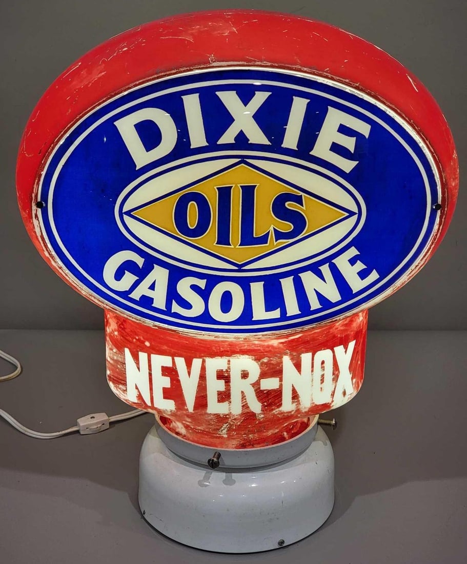 Dixie Oils Gasoline "Never-Nox" Milk Glass Key Hole Globe (TAC): rated 8, 16"T., the oval single lens is in good condition, the milk glass both has wear and scratches, no cracks or breaks. TAC #025222