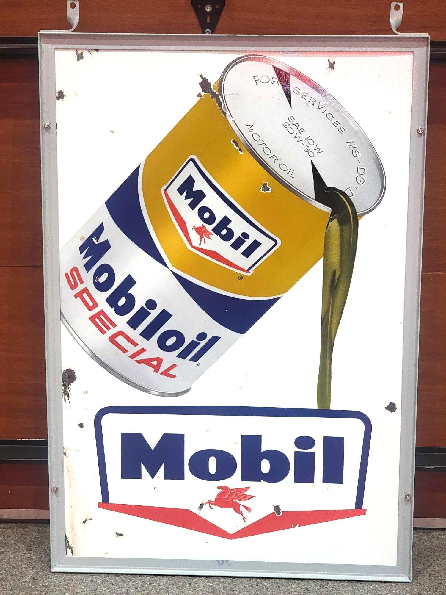 Mobiloil w/Can & Guillotine Logo Porcelain Sign (TAC): rated 7.9, 45.5"x31", the DSP sign has good color and gloss, has chips, wear in both fields, reverse has long chip in the upper field, extra holes along the sides. Rarity 6. TAC #036828