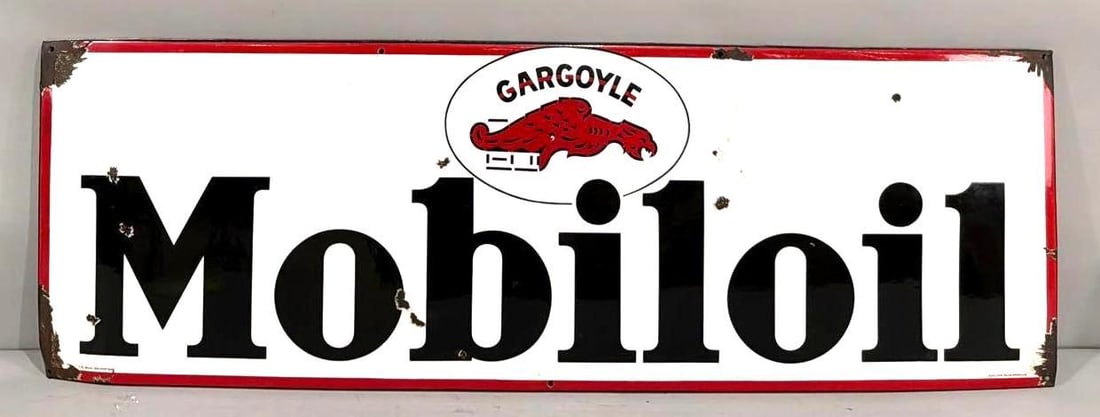 Mobiloil w/Gargoyle Logo Porcelain Sign (TAC): rated 8.25, 19.5"x59", the SSP rolled edge sign has good color and gloss, has small chips in the field, has cease to the right of the logo, large chips at each corner, marked. Rarity 7. TAC #063851