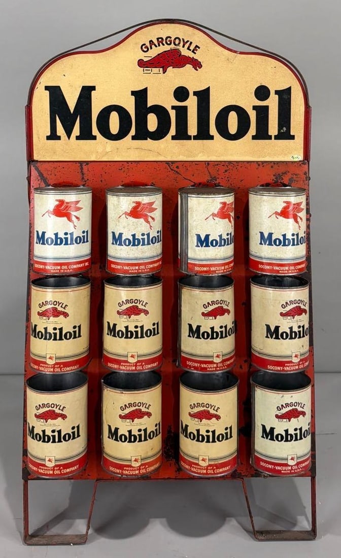 Mobiloil w/Gargoyle Metal Oil Can Rack Sign (TAC): rated 7.5, 10"x20" (just the sign) overall 36"x21"x12", the DST sign is yellowed, the metal stand is rusty, most of the cans have not top or bottom. TAC #036920