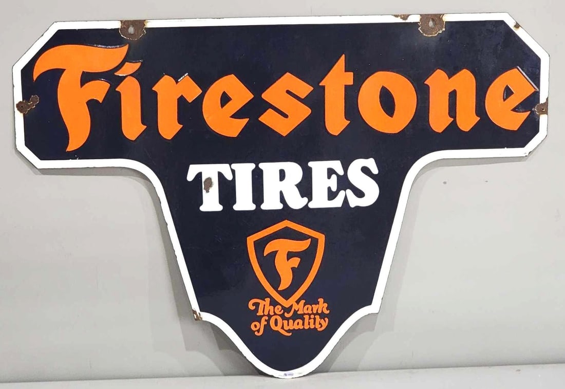 Firestone Tires w/Logo Porcelain Sign (TAC): rated 8.25, 25"x36", the DSP die-cut sign has good color and gloss, has few chips in the field and at the mounting holes, blue has hazy areas. Rarity 5. TAC #036624