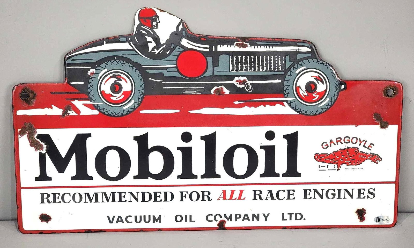 "WOW!" Mobiloil "Recommended for all Race Engines" with early open wheel race car Porcelain Sign: rated 8.5 & 8.25, 9.5"x16", DSP die-cut sign, display has very good color and gloss, has small chips in the car and outer fields, reverse has same chips and minor soiling in the field. Doesn't get muc