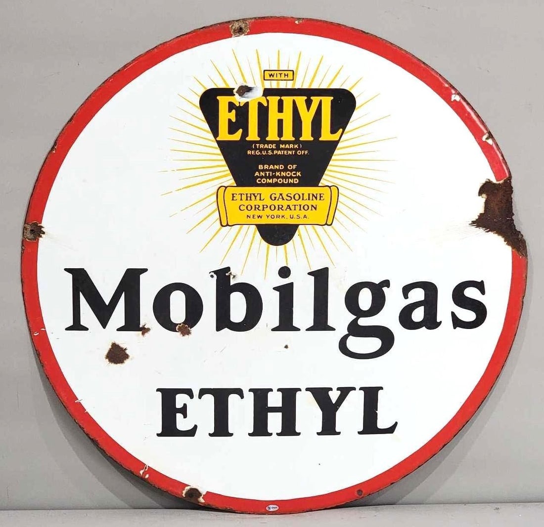 Mobilgas w/Ethyl Logo Porcelain Sign (TAC): rated 7.75, 30"D. the DSP sign has good color and gloss, has chips and wear in the field, large chip at 2 o'clock, couple extra holes around the perimeter. Rarity 5. TAC #036623